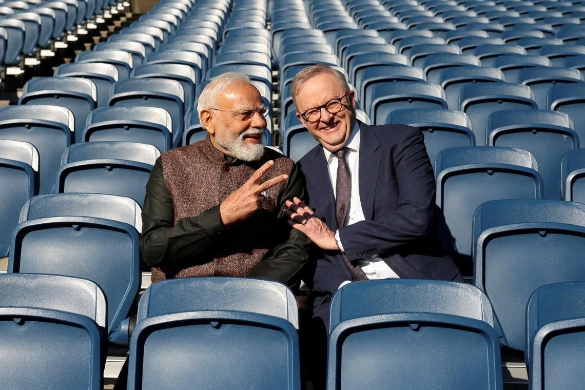Australian Prime Minister Anthony Albanese and Indian Prime Minister Narendra Modi pose for a picture in the stands at the Melbourne Cricket Ground (MCG) in Melbourne, Australia, July 10, 2026. REUTERS/Hollie Adams