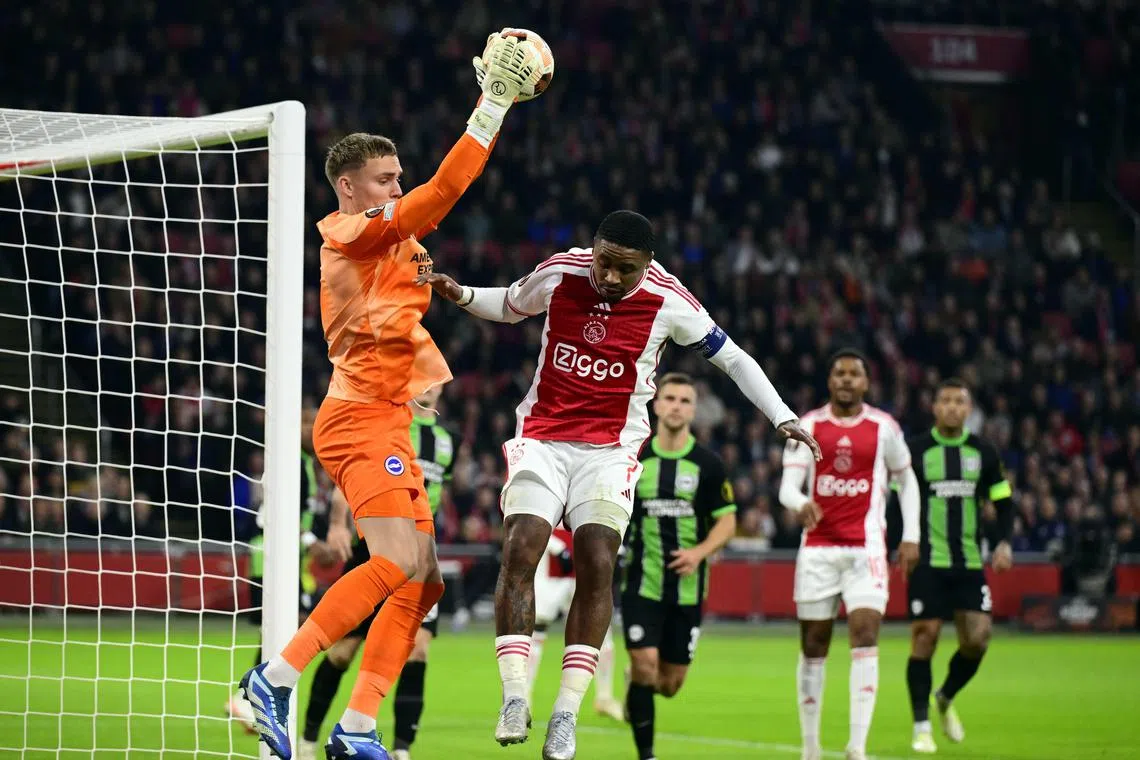 Brighton & Hove Albion's Dutch goalkeeper Bart Verbruggen in action against Ajax Amsterdam's Steven Bergwijn during a Europa League Group B match. Verbruggen has been named the Netherlands No. 1.