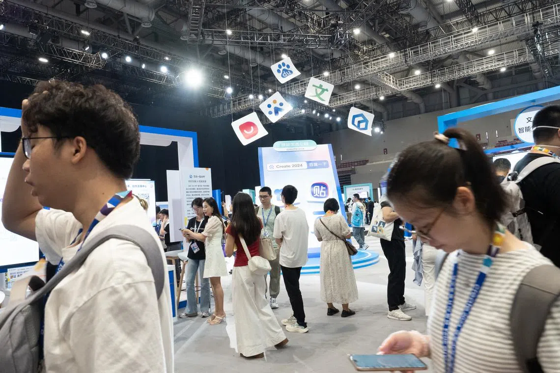 Visitors at the exhibition area of the Baidu annual developer conference in Shenzhen on April 16. 