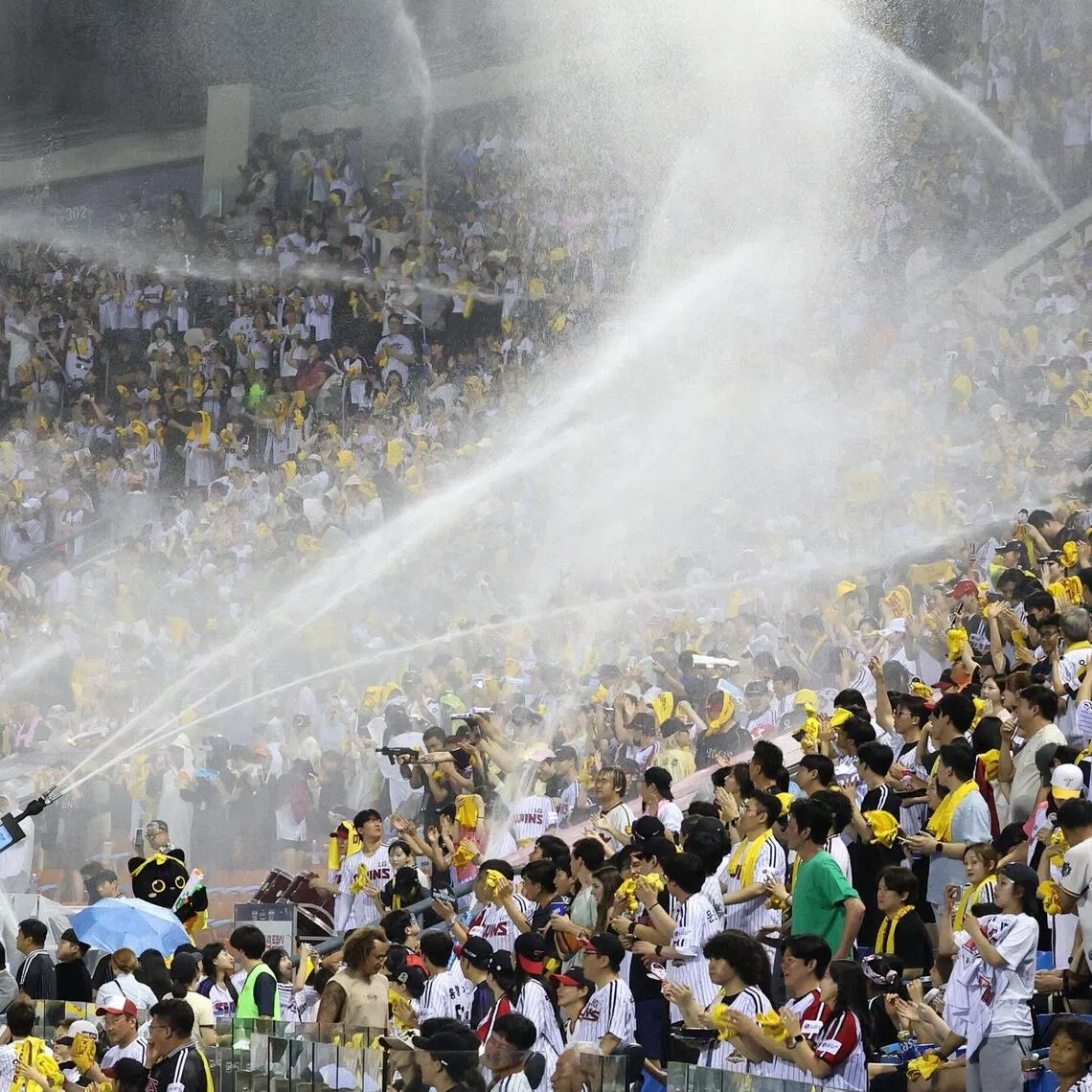 Water cannons being sprayed into the stands to cool off the crowd during a Korean professional baseball game at Jamsil Baseball Stadium in Seoul, on July 29.
