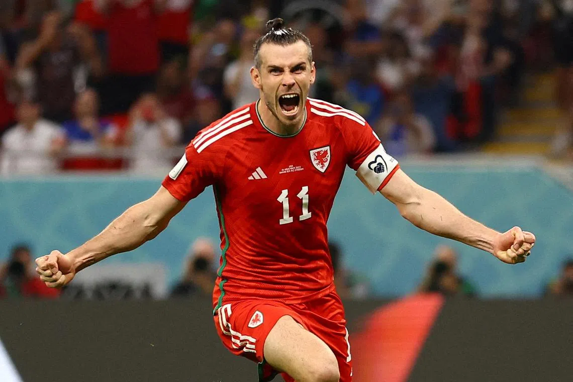 Soccer Football - FIFA World Cup Qatar 2022 - Group B - United States v Wales - Ahmad Bin Ali Stadium, Al Rayyan, Qatar - November 21, 2022  Wales' Gareth Bale celebrates scoring their first goal REUTERS/Hannah Mckay