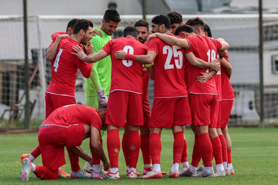 Iran's players gather on the pitch before a 5-0 friendly win over Costa Rica in Antalya, southern Turkey, on March 31, 2026.