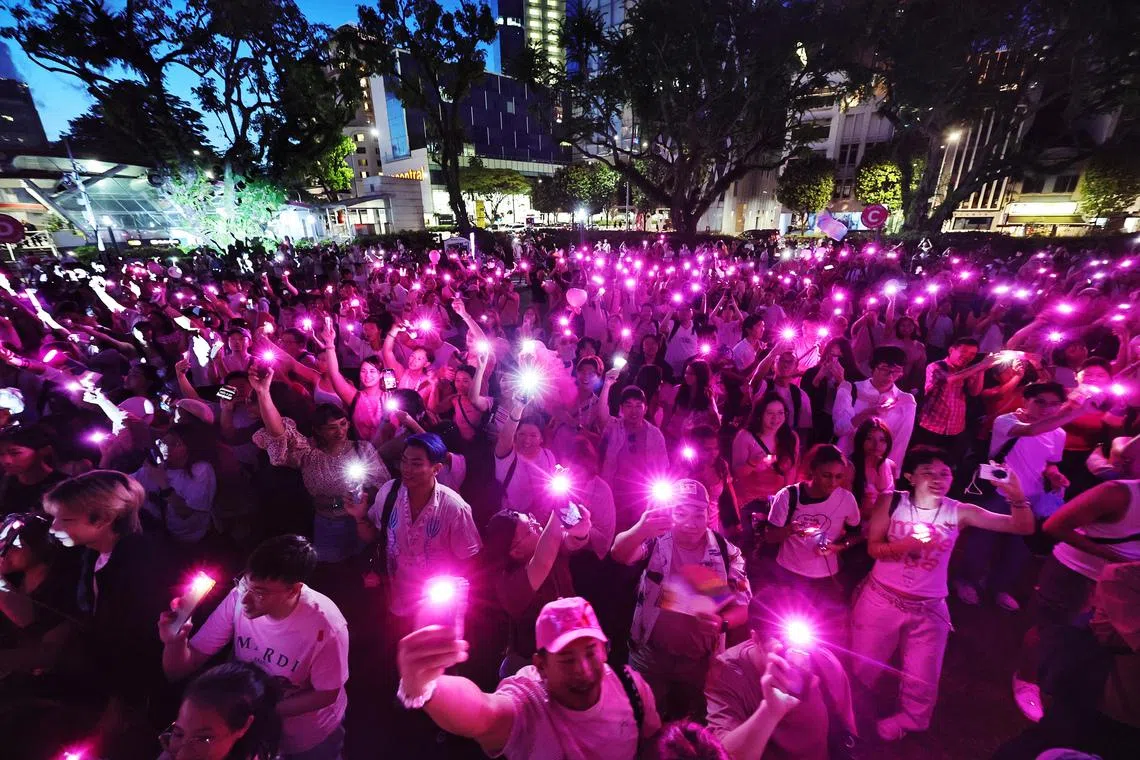 ** EMBARGOED UNTIL 8.30PM SATURDAY, JUNE 27, 2026 ** pixpinkdot27 The night ended with attendees getting together in a light-up formation during the finale of the Pink Dot 18 on June 27, 2026. STPHOTO VIDEO KELVIN CHNG