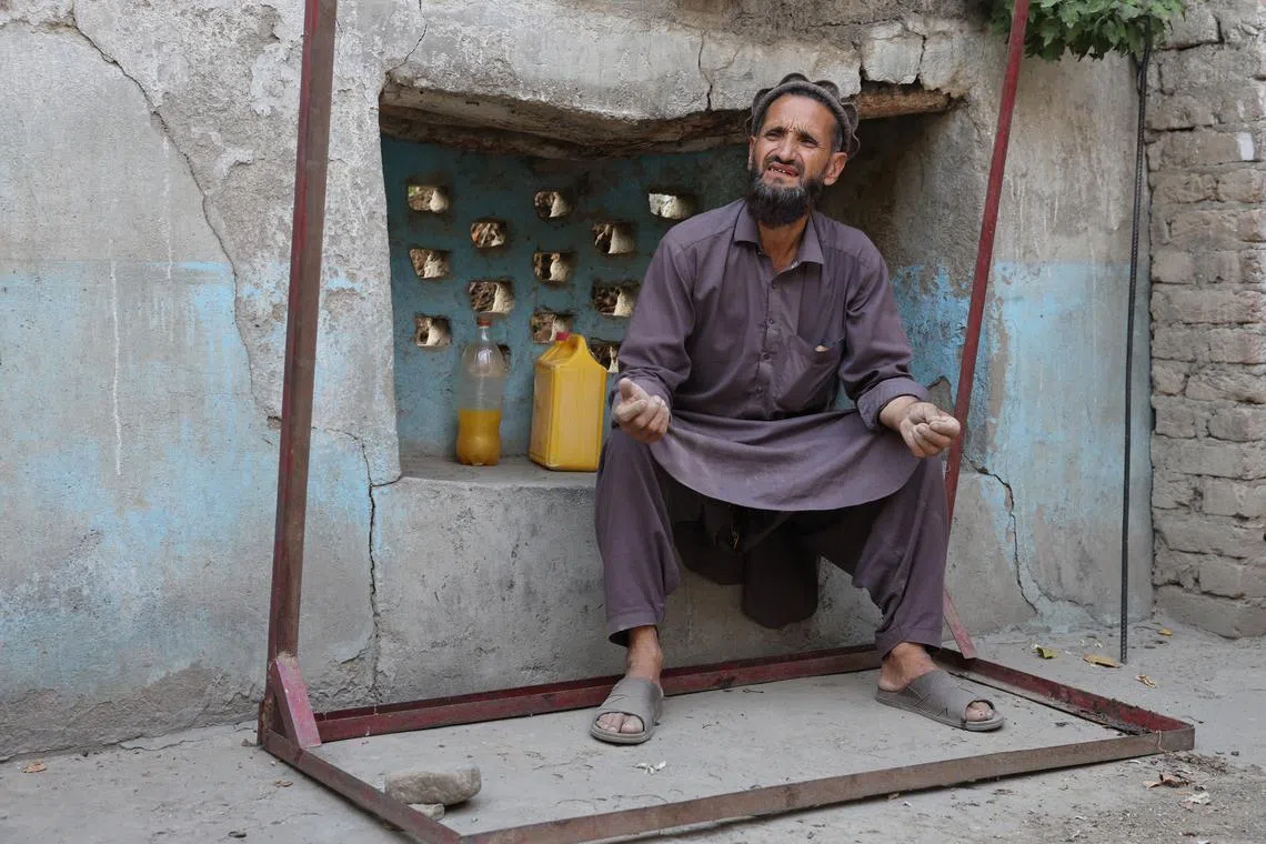 Abdul Ghafar, 52, sits at his partially damaged house as he speaks during an interview with Reuters, following a deadly earthquake in Bambakot village in Dera Noor district in Nangarhar province, Afghanistan September 6, 2025. REUTERS/Sayed Hassib