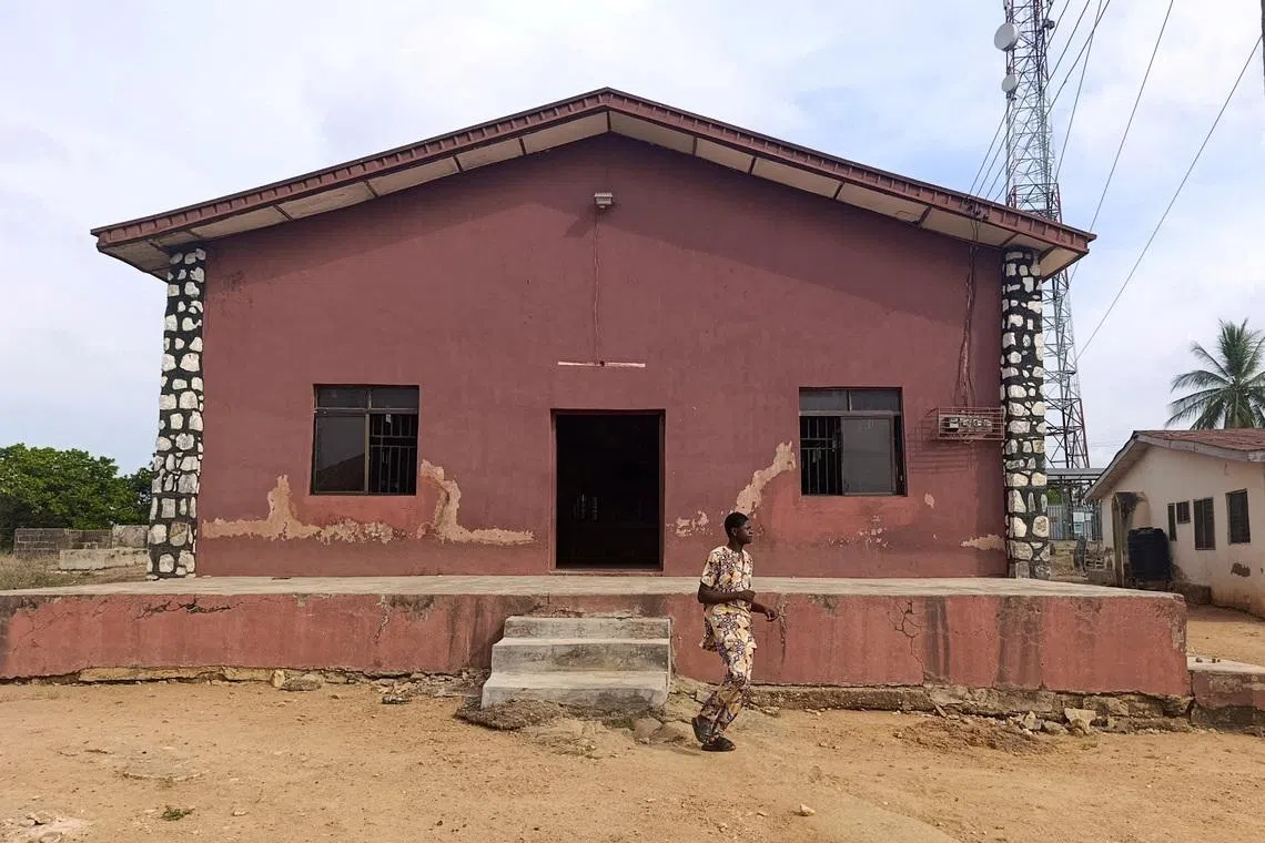 FILE PHOTO: A person walks outside the Christ Apostolic Church during a Sunday service held for those killed and kidnapped in an attack by gunmen on November 18, in the town of Eruku, Kwara state, Nigeria, November 23, 2025. REUTERS/Abdullahi Dare Akogun/File Photo