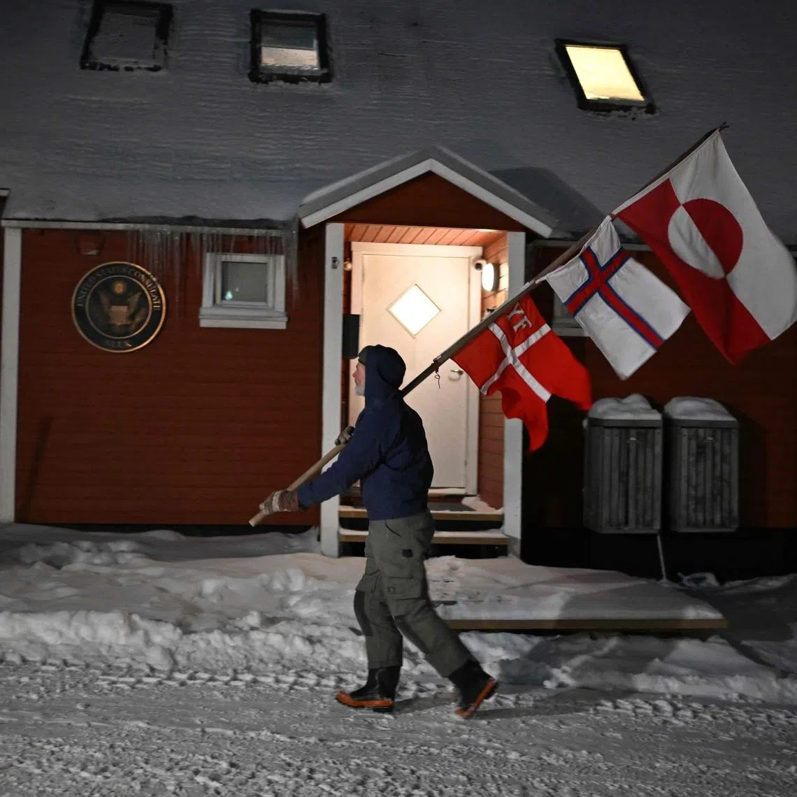 A protestor in front of the US consulate in Greenland on Jan 20, 2026. Canada and France are opening consulates in Greenland in show of support on Feb 6. 