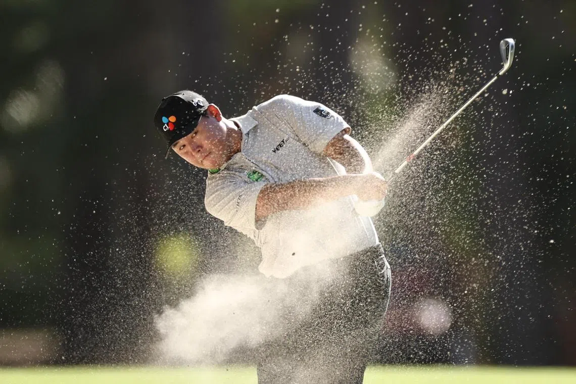 Leader Kim Si-woo of South Korea playing a shot from a bunker on the 15th hole during the third round of the RBC Heritage 2025 at Harbour Town Golf Links on April 19, 2025 in Hilton Head Island, South Carolina. He shot five-under 66 to move into the tournament lead on 15-under 198.