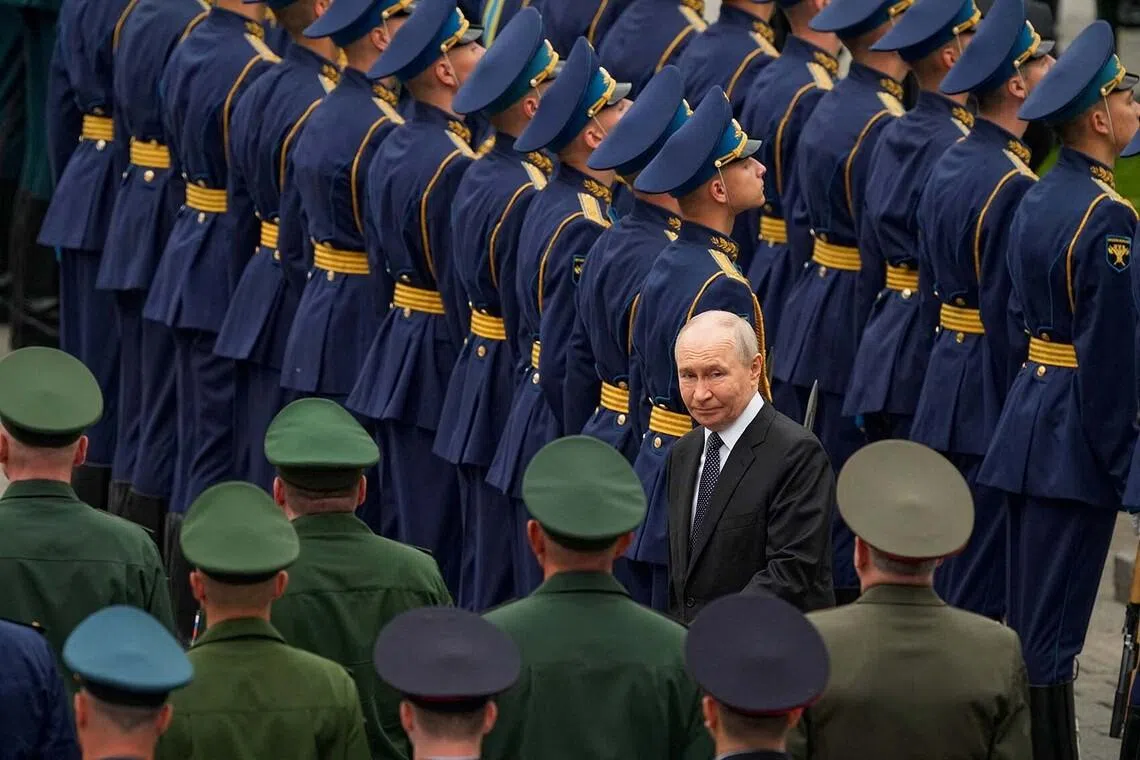Russian President Vladimir Putin arriving for a wreath-laying ceremony marking the 85th anniversary of the Nazi German invasion into the Soviet Union in World War II, on the Remembrance and Sorrow Day at the Tomb of the Unknown Soldier by the Kremlin wall in Moscow, Russia, on June 22.