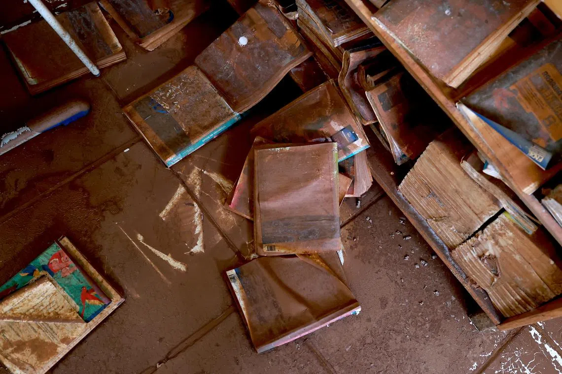 Wet books lay in a classroom at school after floods due to heavy rains in Porto Alegre, Rio Grande do Sul, Brazil, May 22, 2024. REUTERS/Diego Vara