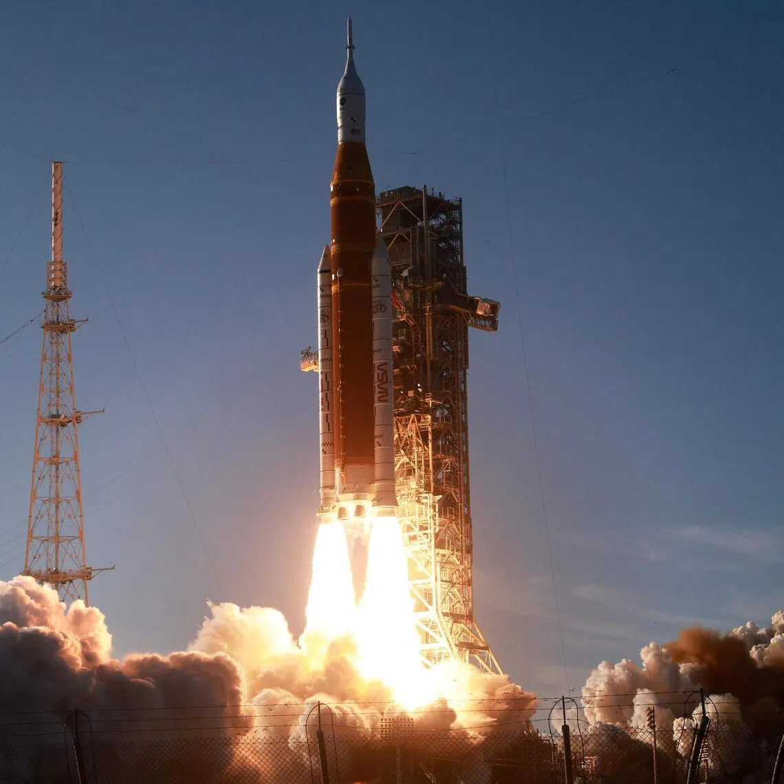 CAPE CANAVERAL, FLORIDA - APRIL 01: NASA's 322-foot-tall Artemis II Space Launch System rocket and Orion spacecraft lifts off from Launch Complex 39B at Kennedy Space Center on April 01, 2026 in Cape Canaveral, Florida. The 10-day mission will take NASA astronauts Commander Reid Wiseman, Pilot Victor Glover and Mission Specialist Christina Koch and CSA (Canadian Space Agency) Mission Specialist Jeremy Hansen around the moon and back. If all goes according to plan, the astronauts will fly 230,000 miles out into space, the farthest any human has ever traveled from Earth.   Joe Raedle/Getty Images/AFP (Photo by JOE RAEDLE / GETTY IMAGES NORTH AMERICA / Getty Images via AFP)
