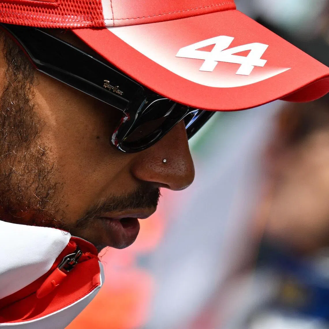 Ferrari's British driver Lewis Hamilton reacts as he takes part in the drivers parade ahead of the Formula One Belgian Grand Prix at the Spa-Francorchamps circuit, in Spa, on July 19, 2026.