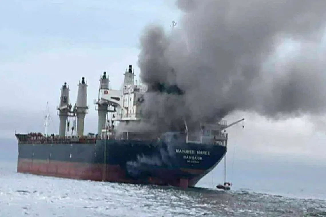 The Thai‑flagged cargo ship Mayuree Naree on fire after being hit by Iranian missiles in the Strait of Hormuz.
