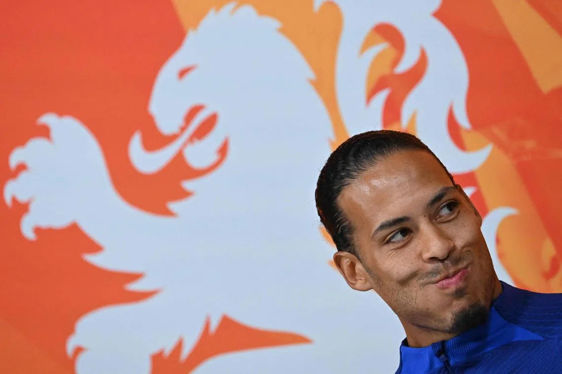 Dutch skipper Van Dijk (above) fielded a flurry of questions about how he and his team mates will deal with the threat of Argentina's Lionel Messi.