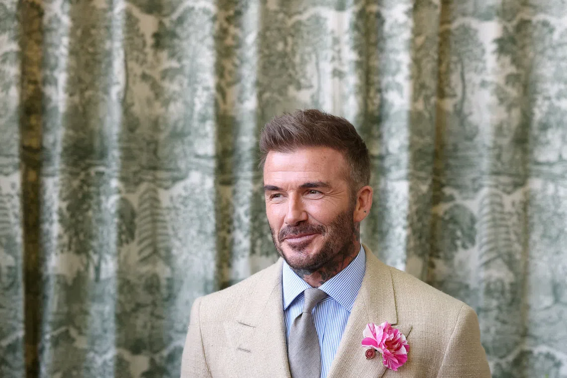 David Beckham, businessman and retired football player, waits to meet Britain's King Charles and Queen Camilla, at the RHS Chelsea Flower Show in London, Britain, May 19, 2025. REUTERS/Toby Melville/Pool