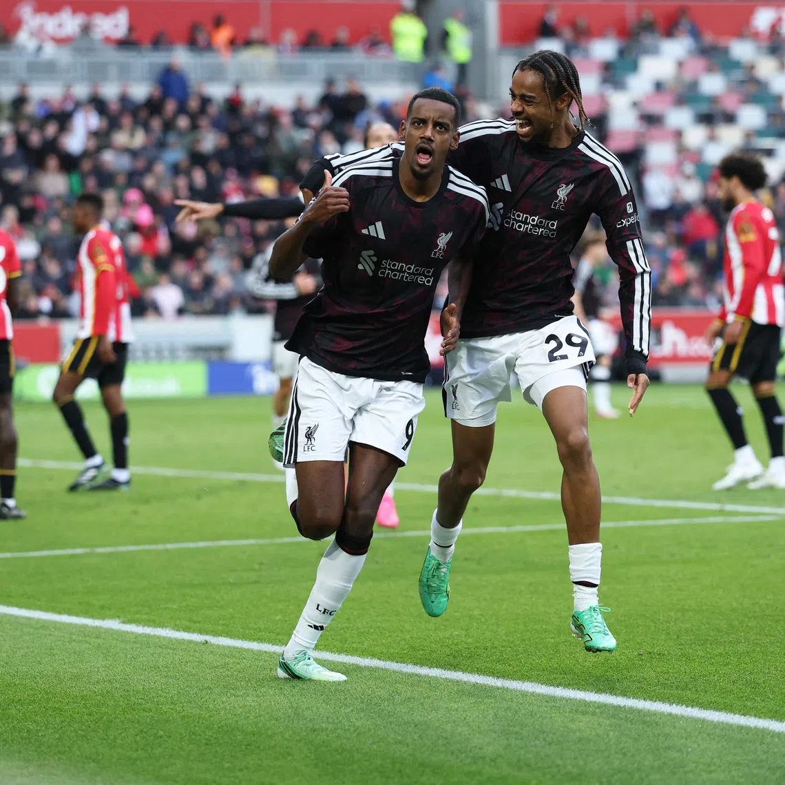 Liverpool’s Alexander Isak celebrates scoring their second goal with Bradley Barcola in London, on Oct 17.