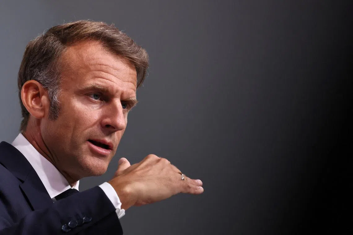 French President Emmanuel Macron gestures during a joint news conference with German Chancellor Friedrich Merz (not seen) as part of a Franco-German cabinet meeting and a meeting of the Franco-German Defence and Security Council (CFADS) in Toulon, France, August 29, 2025. REUTERS/Manon Cruz/Pool