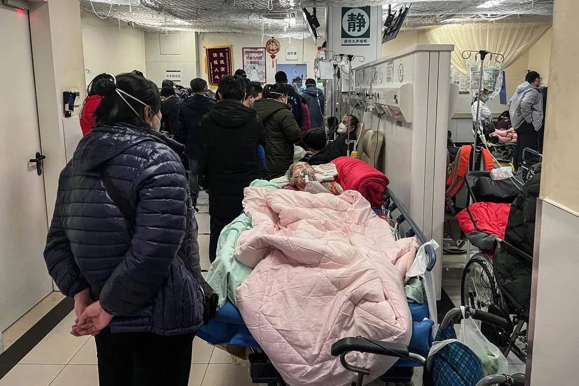 A patient is treated on a bed in a corridor of the emergency department of a hospital in Beijing on Jan 3, 2023. WHO advisers have said the hospitalisation numbers reported by China is “not very credible”.