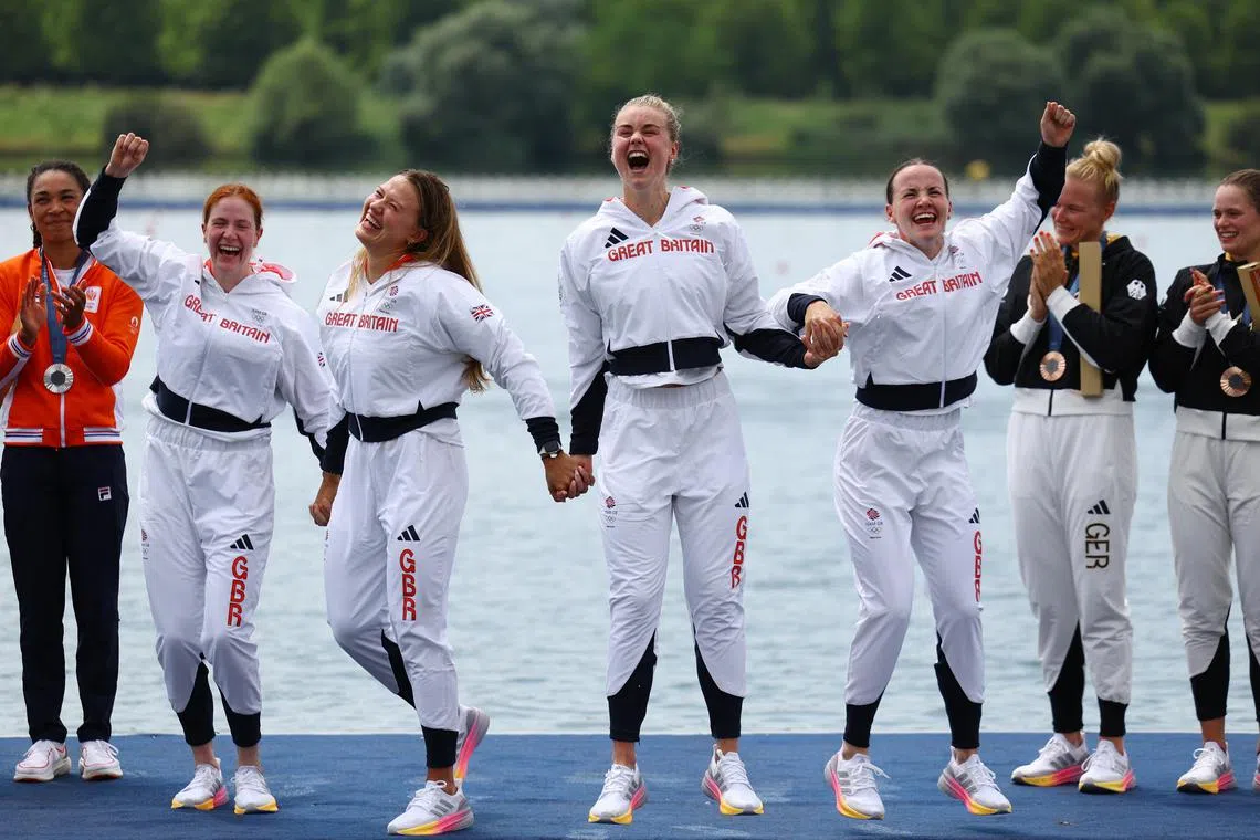 Gold medallists Lauren Henry, Hannah Scott, Lola Anderson and Georgina Brayshaw of Britain celebrate after winning gold in the women's quadruple sculls final.