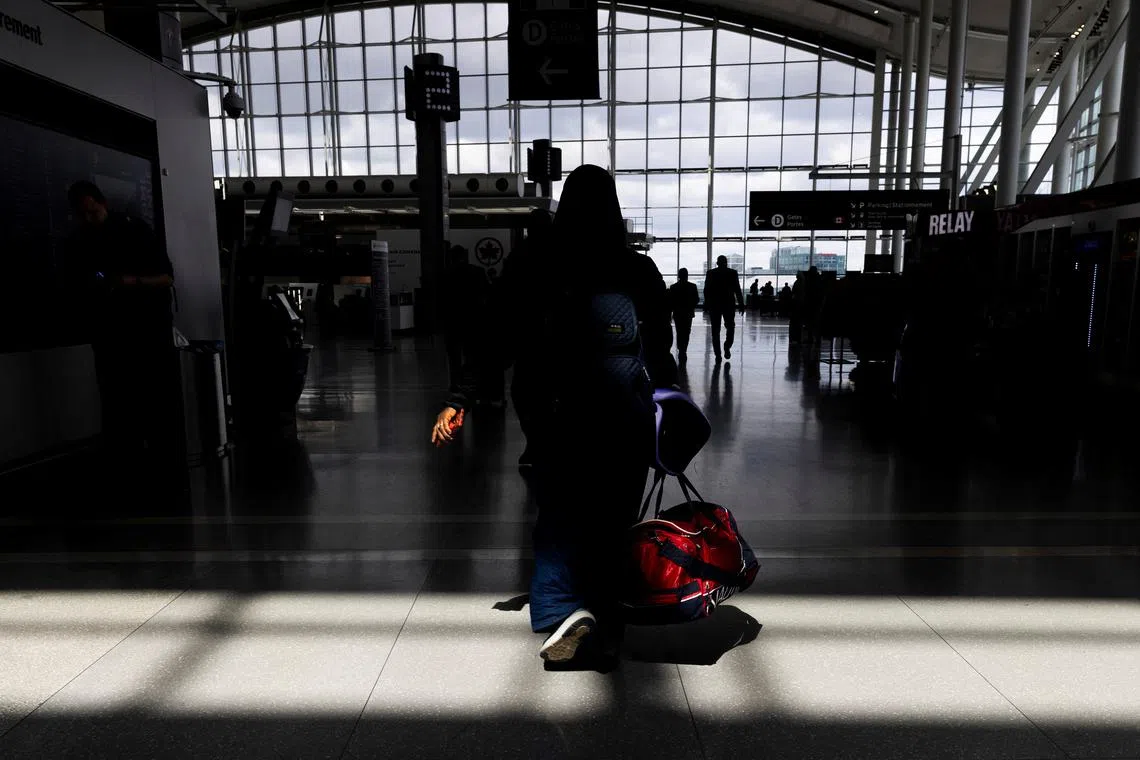 People move about the departures terminal at Toronto Pearson International Airport in Mississauga, Ontario, Canada April 25, 2023.  REUTERS/Carlos Osorio/File Photo