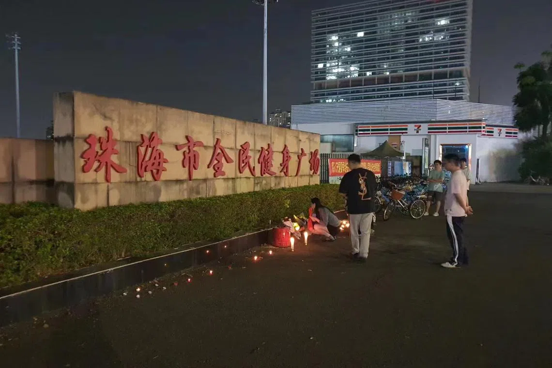 People have been thronging the crime scene, leaving flowers and lighting candles outside the barricaded facility.
