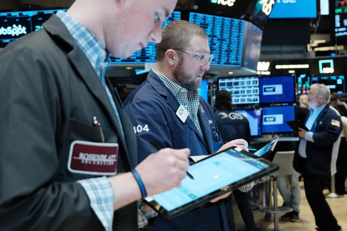 Traders work on the floor of the New York Stock Exchange.