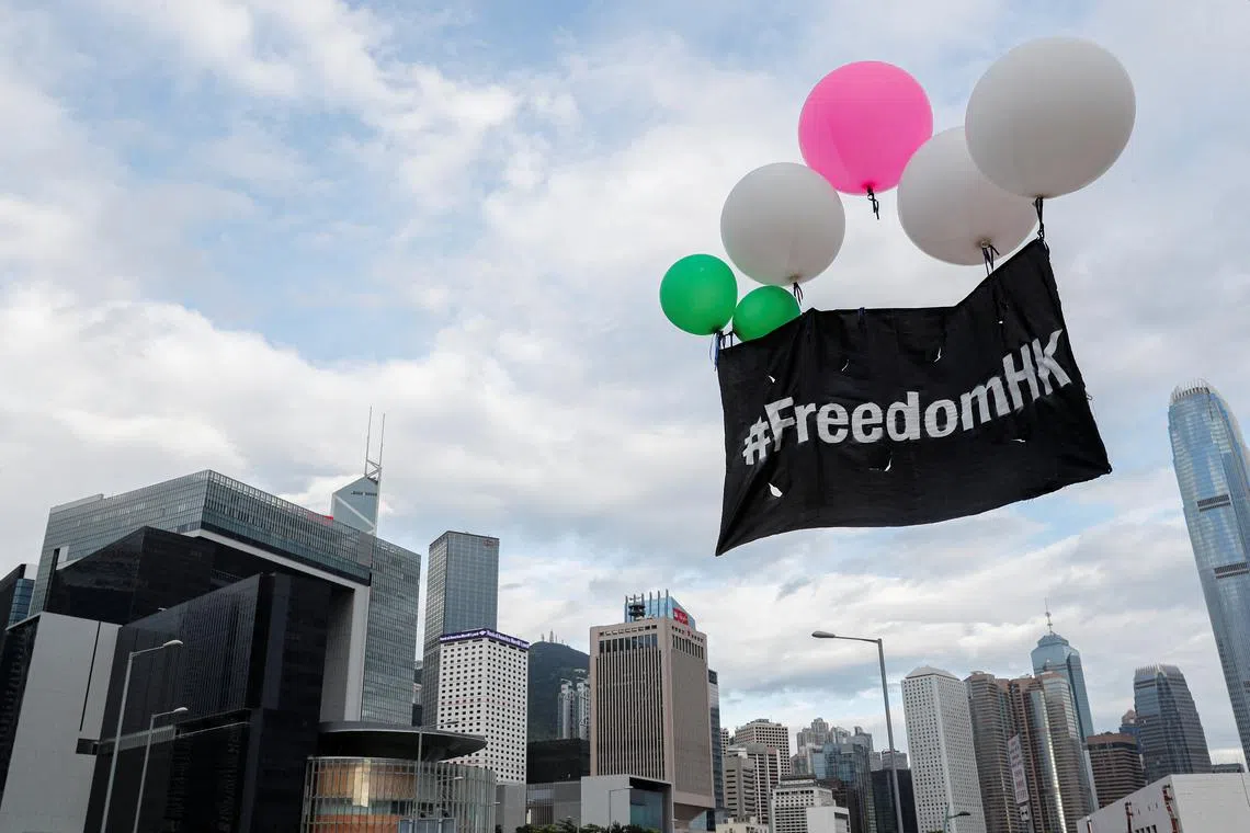 FILE PHOTO: Balloons with protest slogans are seen outside the Legislative Council building during the anniversary of Hong Kong's handover to China in Hong Kong, China July 1, 2019. REUTERS/Tyrone Siu/File Photo
