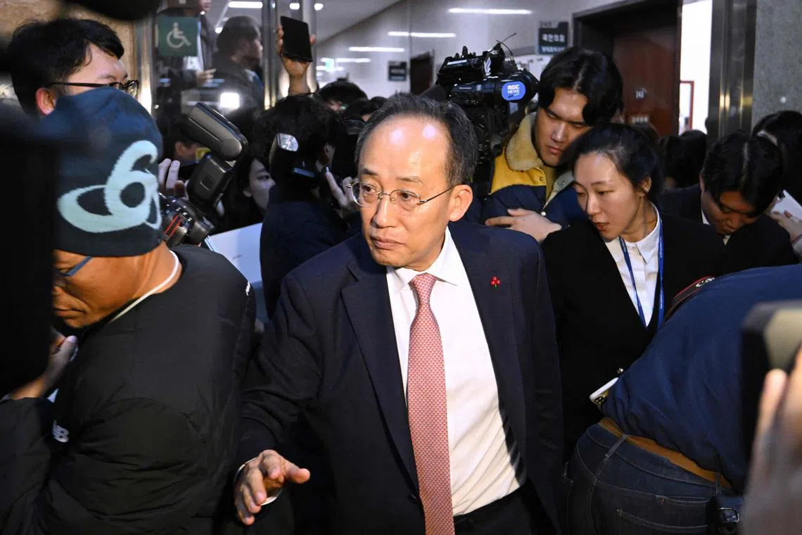 South Korea's ruling People Power Party's floor leader Choo Kyung-ho is surrounded by reporters as he leaves after a meeting with the party leader Han Dong-hoon at the National Assembly in Seoul on Dec 6.