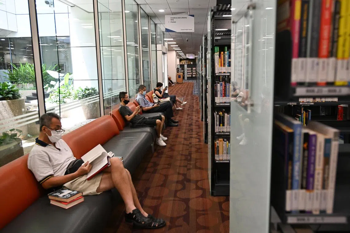 Visitors reading in Central Public Library.
