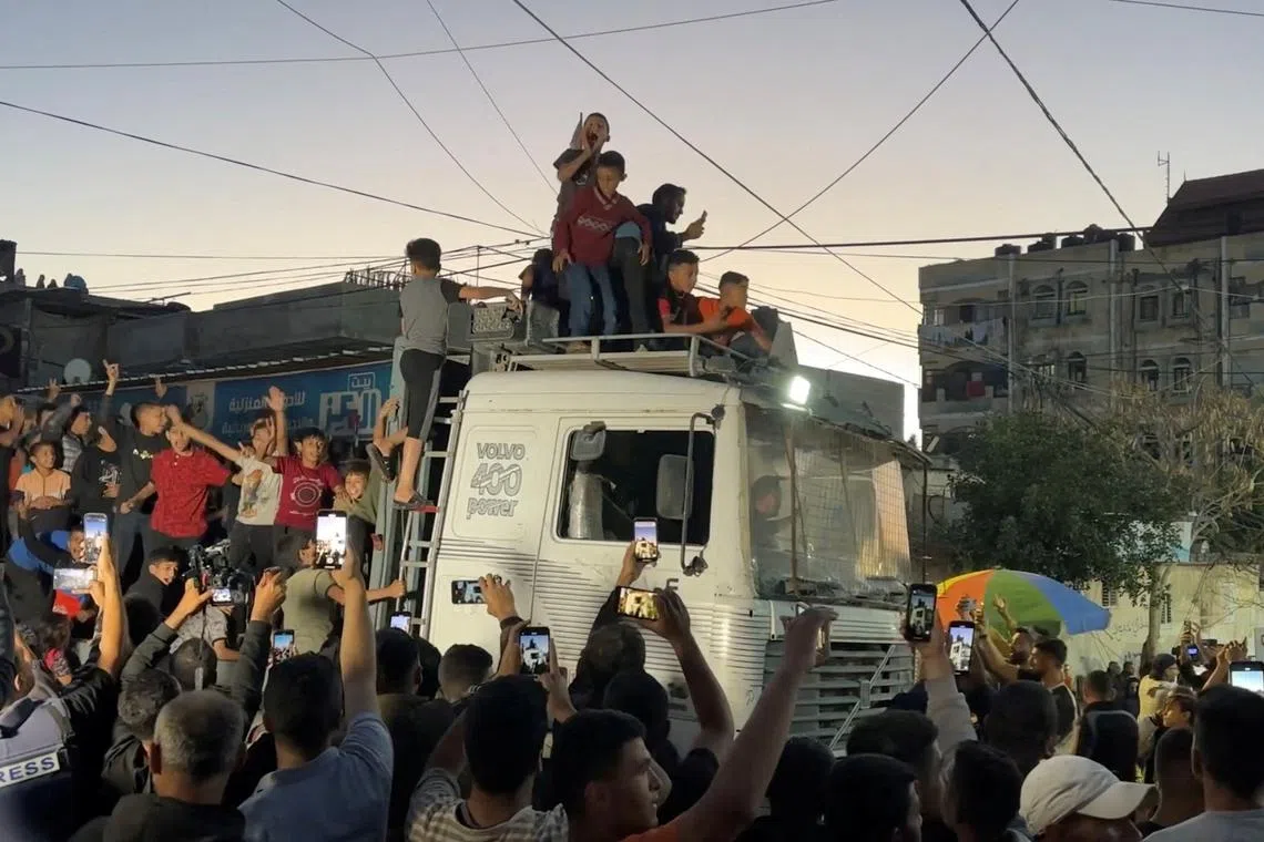 Palestinians react after Hamas accepted a ceasefire proposal from Egypt and Qatar, in Rafah, in the southern Gaza Strip, May 6, 2024. in this screengrab taken from video. Reuters TV via REUTERS