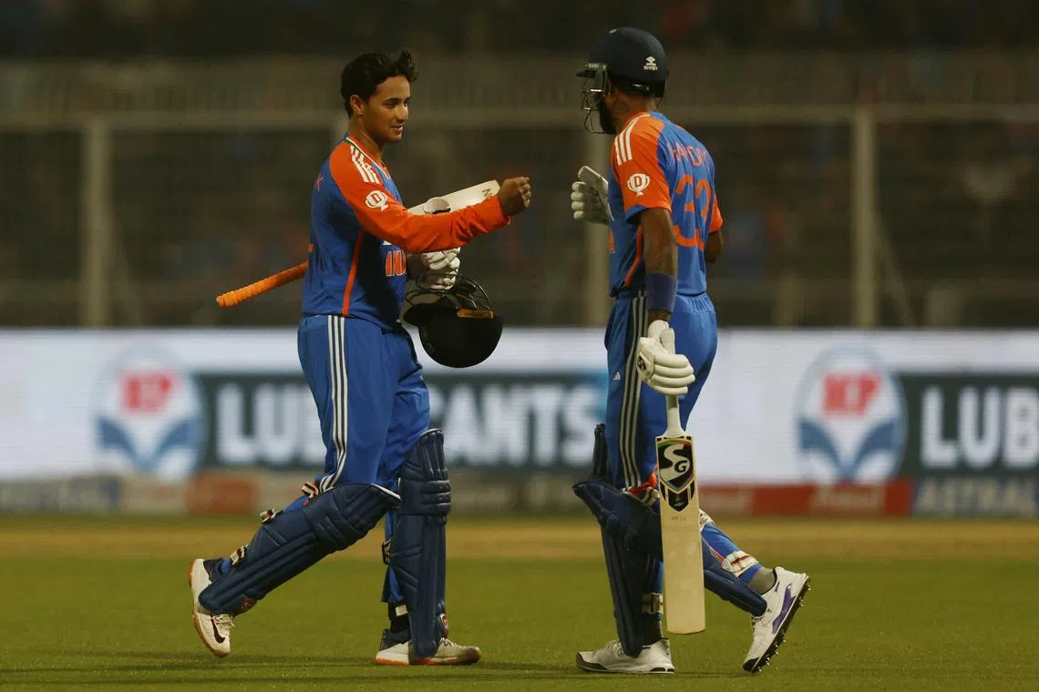 Cricket - First T20 International - India v England - Eden Gardens, Kolkata, India - January 22, 2025 India's Abhishek Sharma walks past India's Hardik Pandya after losing his wicket, caught by England's Harry Brook off the bowling of England's Adil Rashid REUTERS/Sahiba Chawdhary