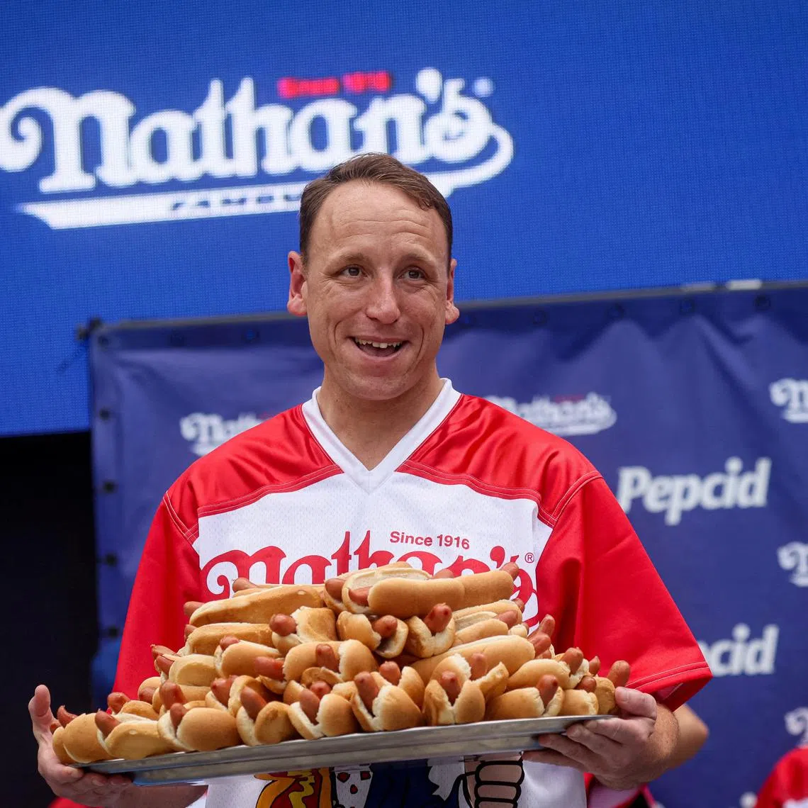 World Champion Joey Chestnut during the weigh-in ceremony ahead of  2023 Nathan's Famous Fourth of July International Hot Dog Eating Contest in Coney Island Brooklyn in New York City.
