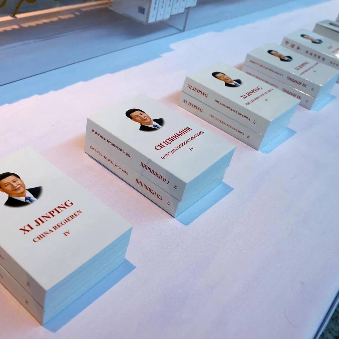 FILE PHOTO: Copies of \"Xi Jinping: The Governance of China\" translated into nine languages are displayed outside the media center ahead of the Third Belt and Road Forum in Beijing, China October 16, 2023. REUTERS/Edgar Su/File Photo
