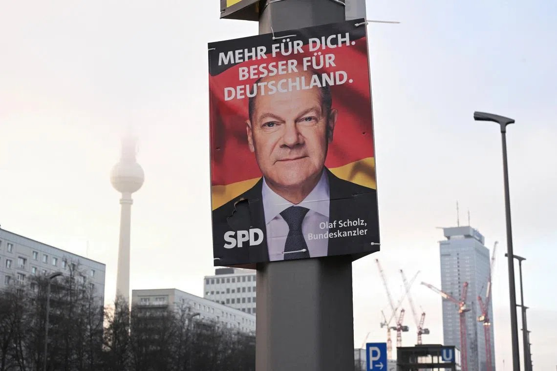FILE PHOTO: An election campaign poster depicting Olaf Scholz, the top candidate of Social Democratic Party of Germany (SPD) for the upcoming 2025 general election, is pictured in Berlin, Germany January 17, 2025. REUTERS/Annegret Hilse/File Photo
