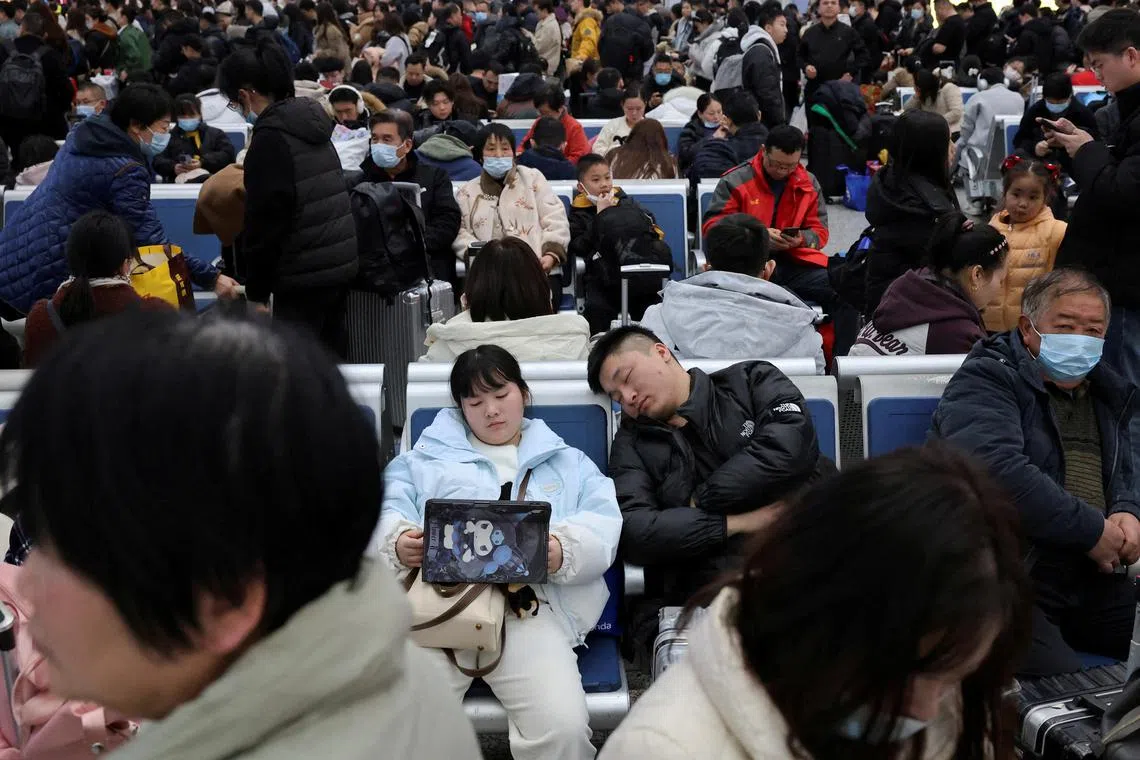 People wait for their train at the waiting hall during the Spring Festival travel rush ahead of the Lunar New Year, at Shanghai Hongqiao railway station in Shanghai, China on January 24, 2025.  