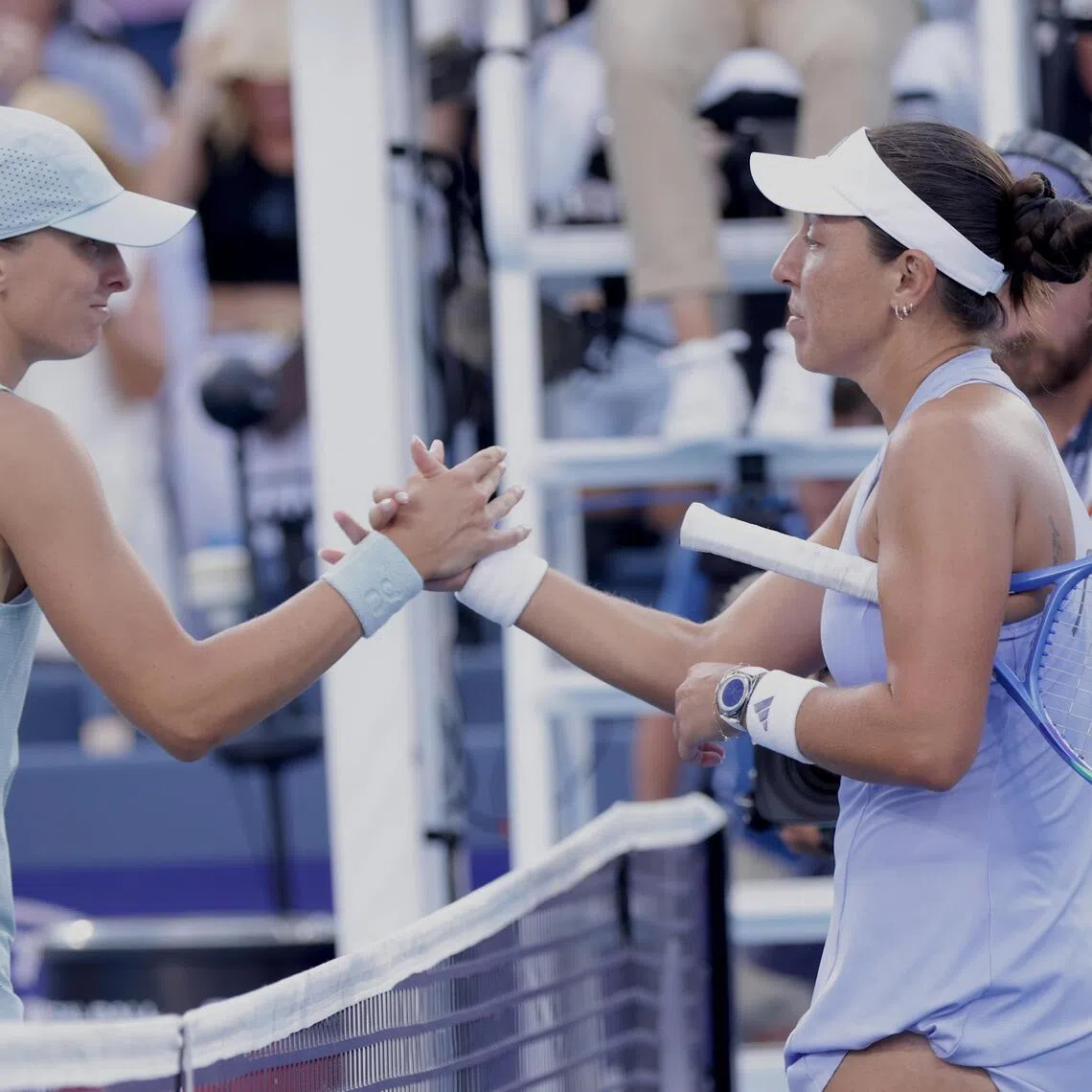 Jessica Pegula (right) of the USA shakes hands with Iga Swiatek (left) after defeating the Pole in their semi-final at the Cincinnati Open on Aug 22.
