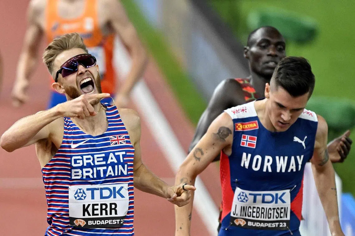 Britain's Josh Kerr celebrates next to Norway's Jakob Ingebrigtsen after winning the men's 1500m final.