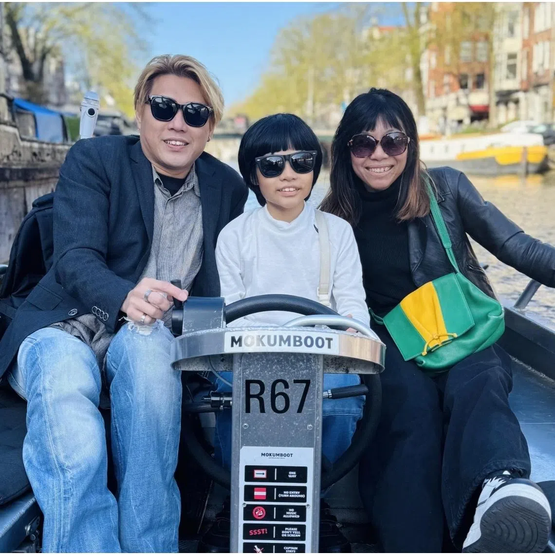 Singaporean piano prodigy Mikkel Myer Lee (centre) with his parents at their Amsterdam holiday.