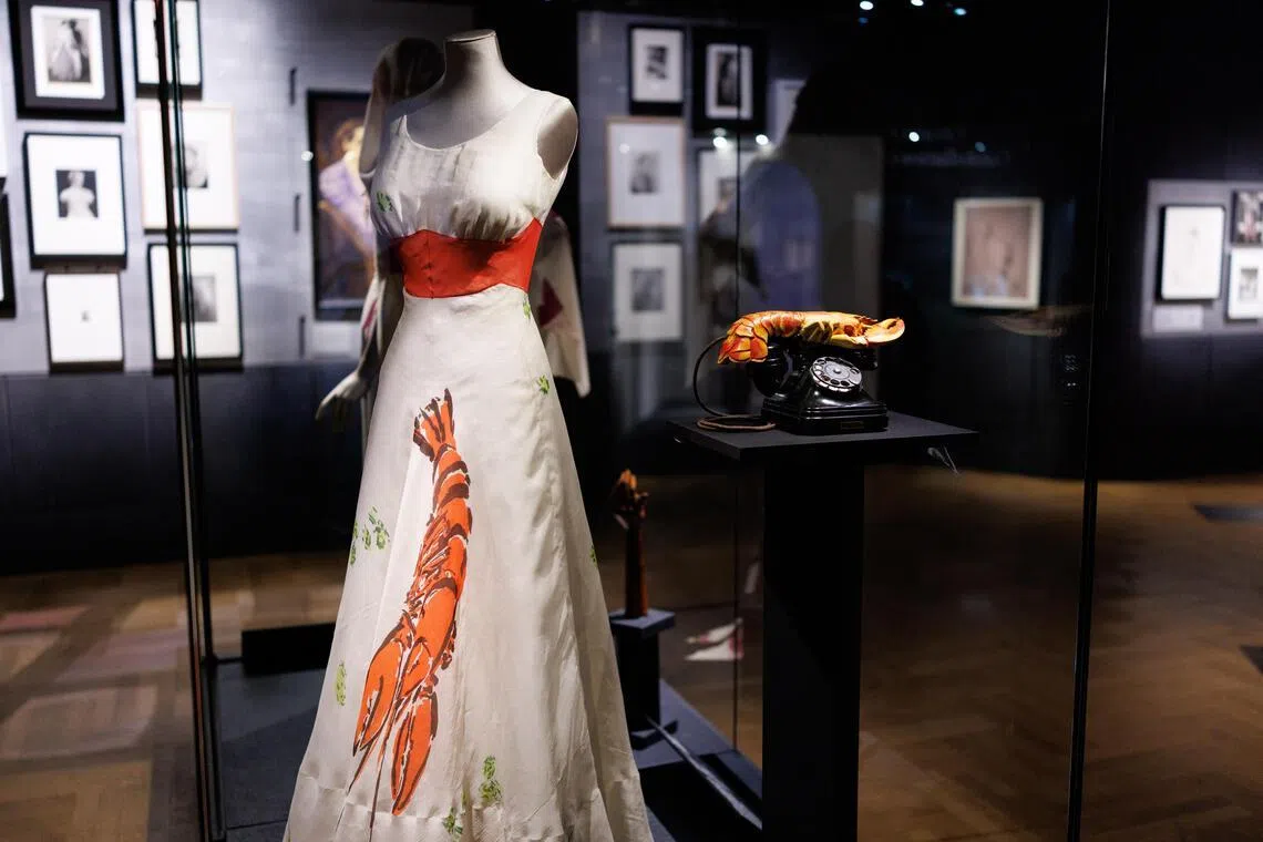 The Lobster Dress by Italian fashion designer Elsa Schiaparelli and the Lobster Telephone, created by the Spanish artist Salvador Dali, at Schiaparelli: Fashion Becomes Art. 