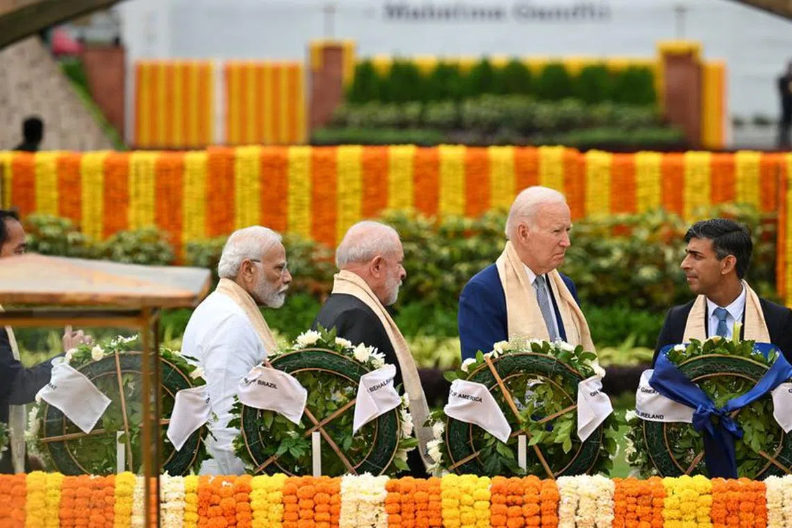 Prime Minister of India Narendra Modi, Brazil President Luiz Inacio Lula da Silva, U.S. President Joe Biden and UK Prime Minister Rishi Sunak visit Raj Ghat memorial with other G20 leaders, Sept. 10, 2023, in New Delhi. Kenny Holston/Pool via REUTERS