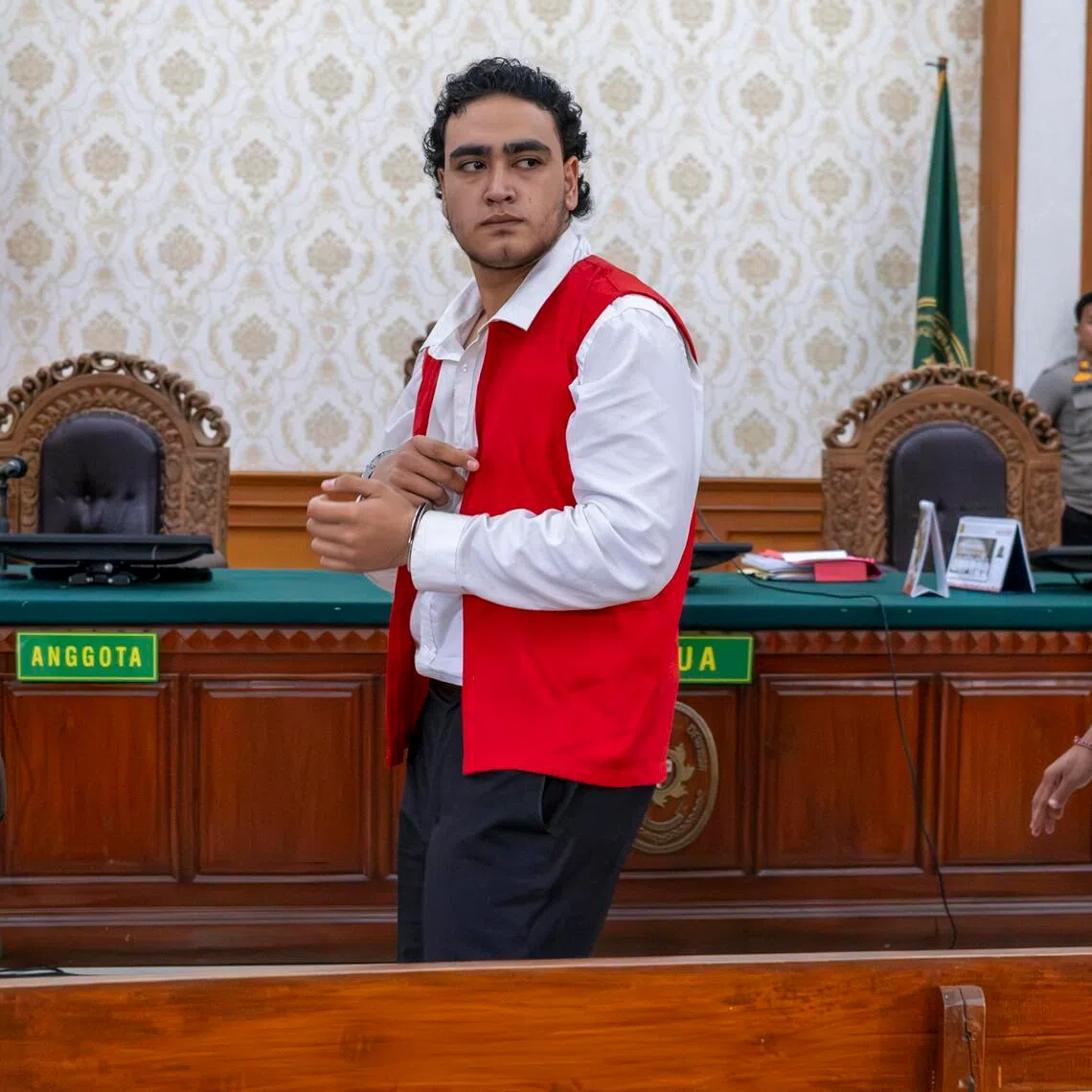 Gunmen Paea-I-Middlemore Tupou (left) and Mevlut Coskun at the Denpasar District Court on March 9.