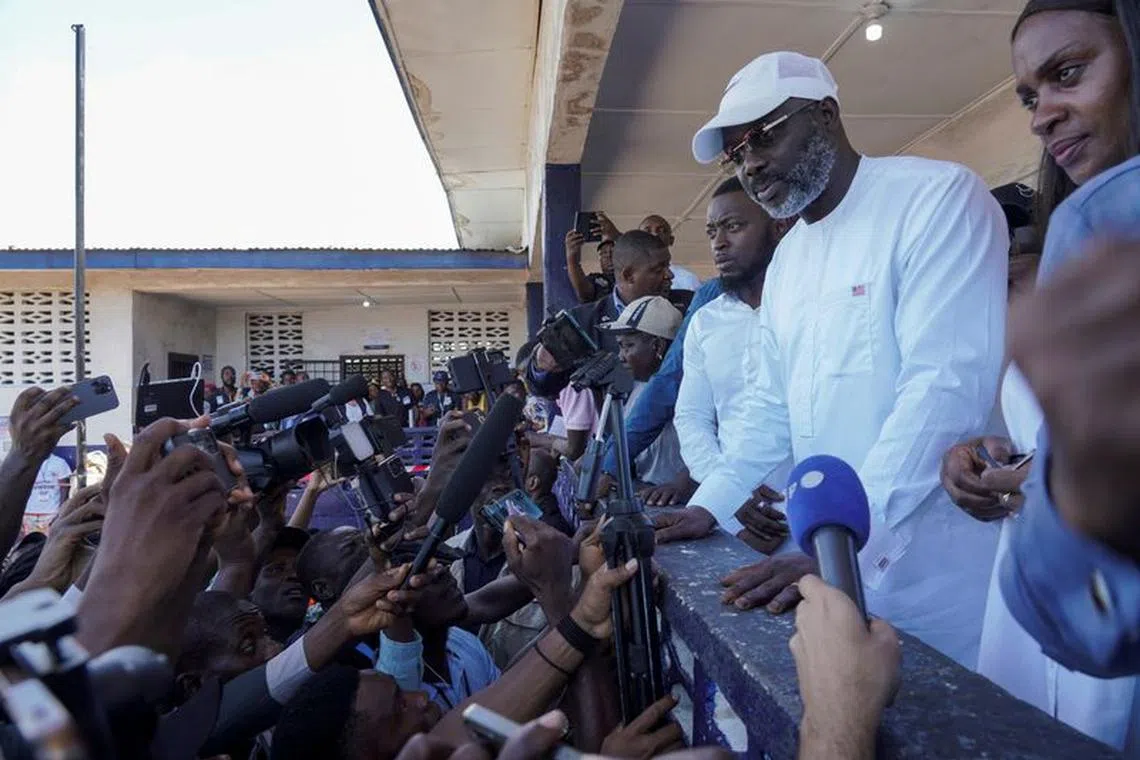 Leader of Liberia's ruling party Coalition for Democratic Change(CDC), President and former soccer player George Weah, speaks to the press after casting his vote during the presidential elections in Monrovia, Liberia, October 10, 2023. REUTERS/Carielle Doe/ File Photo