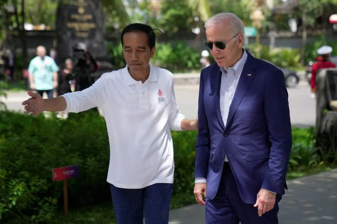 Indonesian President Joko Widodo greets U.S. President Joe Biden upon his arrival for a mangrove planting event at Ngurah Rai Forest Park, on the sidelines of the G20 summit in Denpasar, Bali, Indonesia November 16, 2022. Dita Alangkara/Pool via REUTERS/File Photo