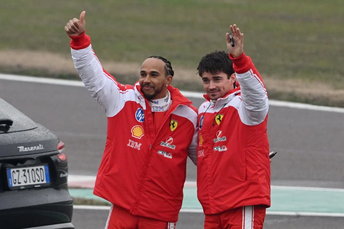Formula One F1 - Ferrari's Lewis Hamilton and Ferrari's Charles Leclerc drive Ferrari's new Formula 1 car the SF-26 during testing - Fiorano Circuit, Maranello, Italy - January 23, 2026 Ferrari's Lewis Hamilton and Charles Leclerc wave to fans during testing. REUTERS/Jennifer Lorenzini