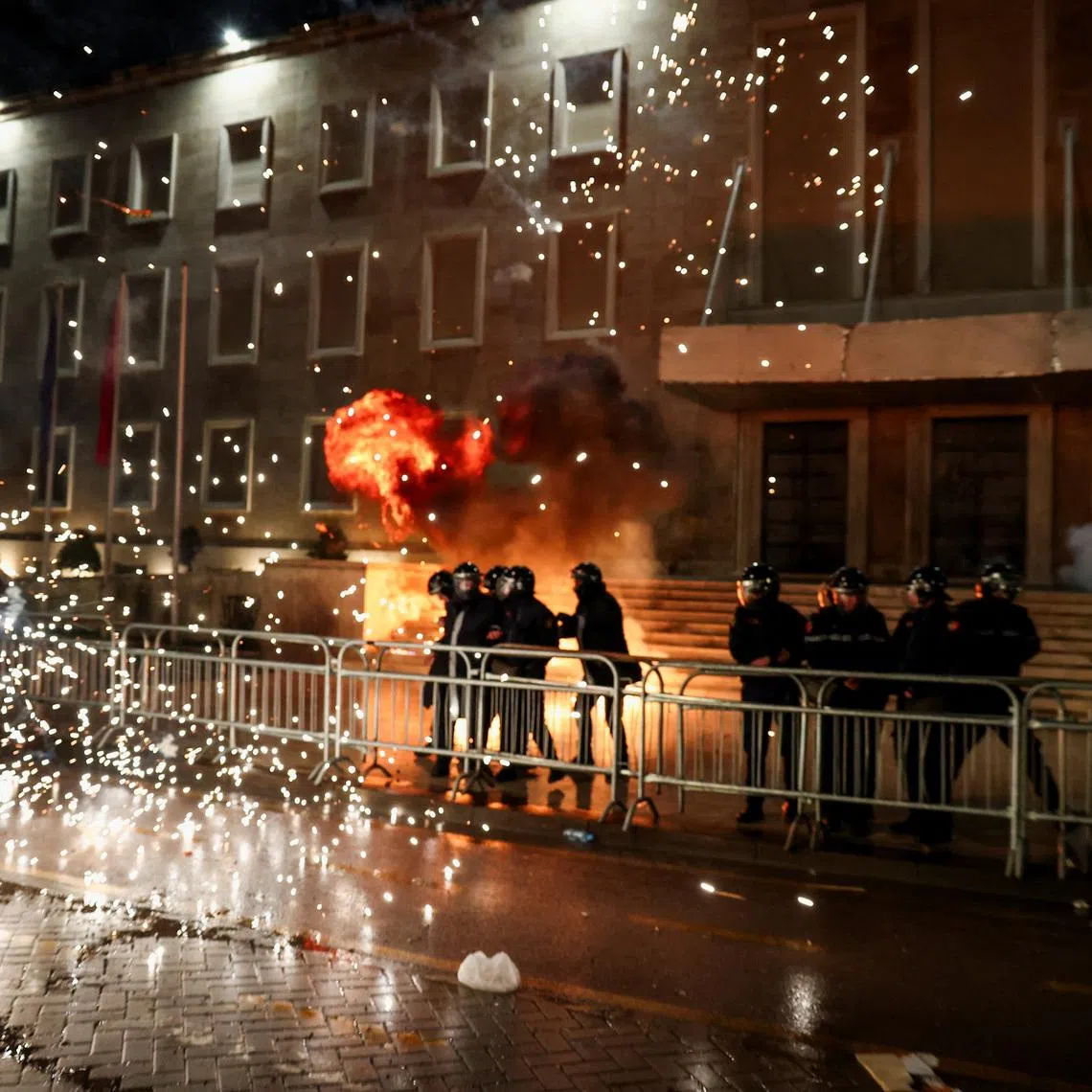 Police members operate during an anti-government protest, triggered by a corruption investigation into Deputy Prime Minister Belinda Balluku, in front of the Prime Minister's office in Tirana, Albania, February 10, 2026. REUTERS/Florion Goga