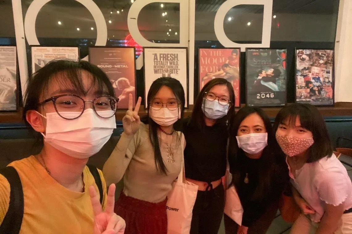 The writer (far right) with her friends at a 2021 movie screening at The Projector.