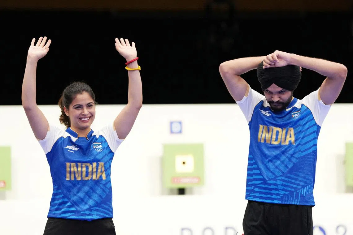 FILE PHOTO: Paris 2024 Olympics - Shooting - 10m Air Pistol Mixed Team Bronze Medal - Chateauroux Shooting Centre, Deols, France - July 30, 2024. Manu Bhaker of India (L) and Sarabjot Singh of India celebrate their win REUTERS/Amr Alfiky/File Photo