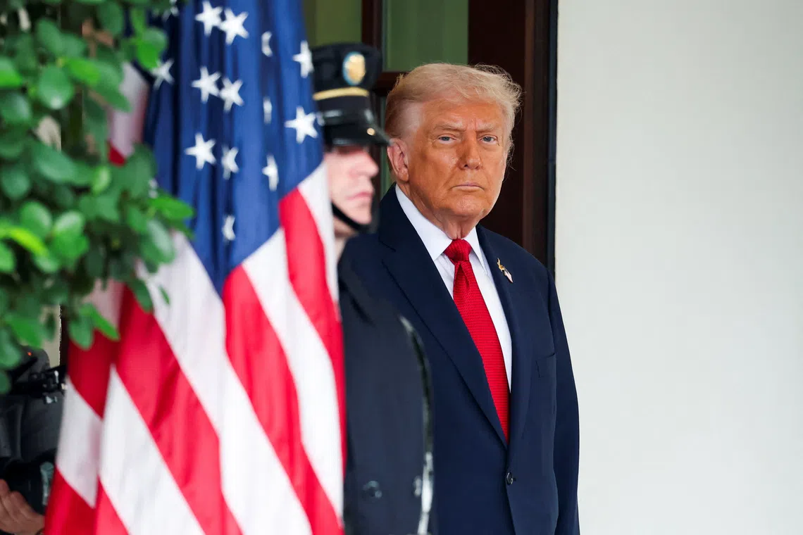 FILE PHOTO: U.S. President Donald Trump waits to welcome Turkey's President Recep Tayyip Erdogan at the White House in Washington, D.C., U.S., September 25, 2025. REUTERS/Jonathan Ernst/File Photo