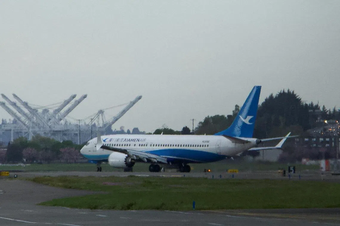 A Boeing 737 MAX plane, intended for China's Xiamen Airlines, arrives at Seattle’s Boeing Field.