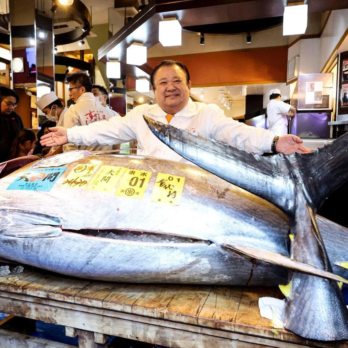 Mr Kiyoshi Kimura, President of sushi restaurant chain Sushizanmai's the Tokyo-based operator Kiyomura, displays a 243kg bluefin tuna that fetched 510.3 million yen (S$4.18 million) at his main restaurant in Tokyo on Jan 5, 2026, after the New Year's auction at Toyosu fish market. 