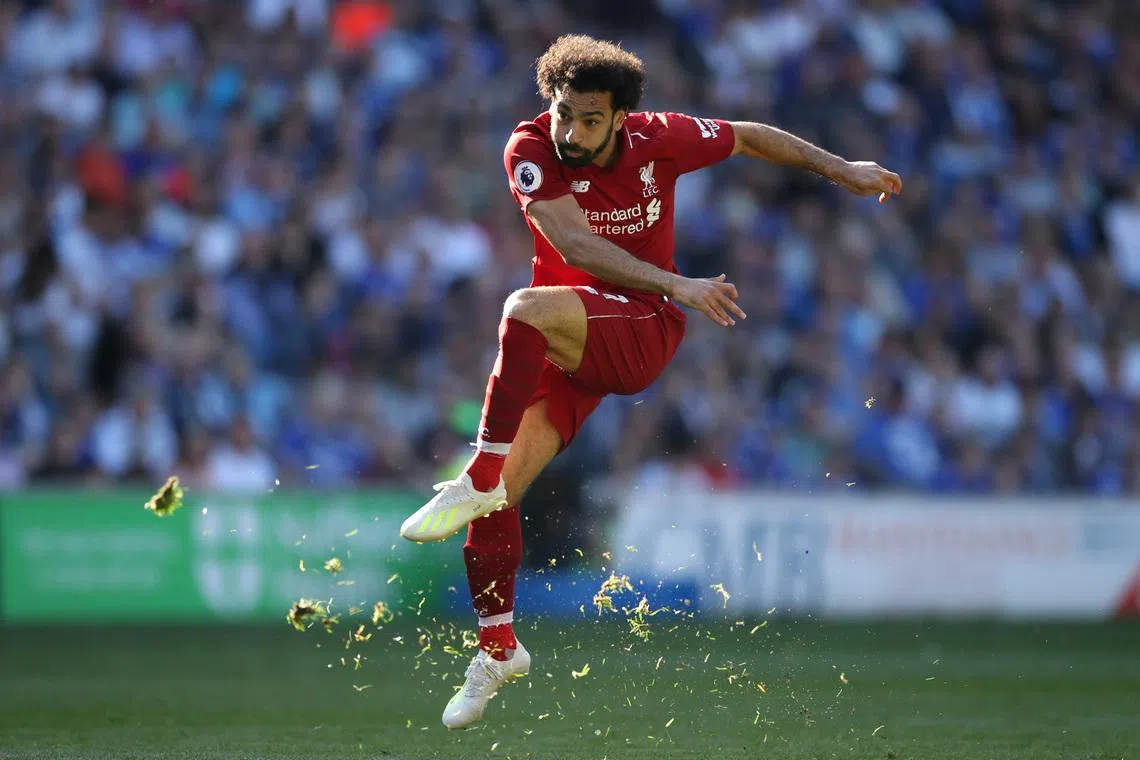 FILE PHOTO: Soccer Football - Premier League - Cardiff City v Liverpool - Cardiff City Stadium, Cardiff, Britain - April 21, 2019   Liverpool's Mohamed Salah shoots at goal   Action Images via Reuters/Carl Recine/File Photo